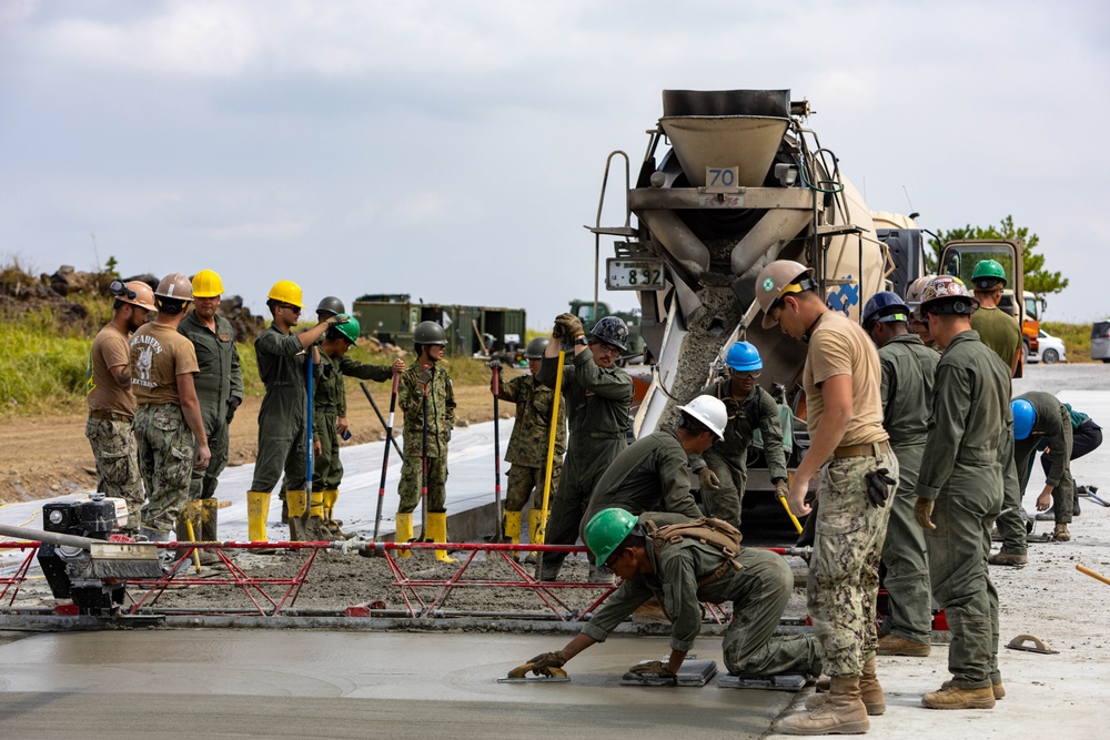 All in a day's work - Japan Ground Self-Defense Force, U.S. Marines, and Sailors prepare Kirishima Training Area for airfield damage repair training