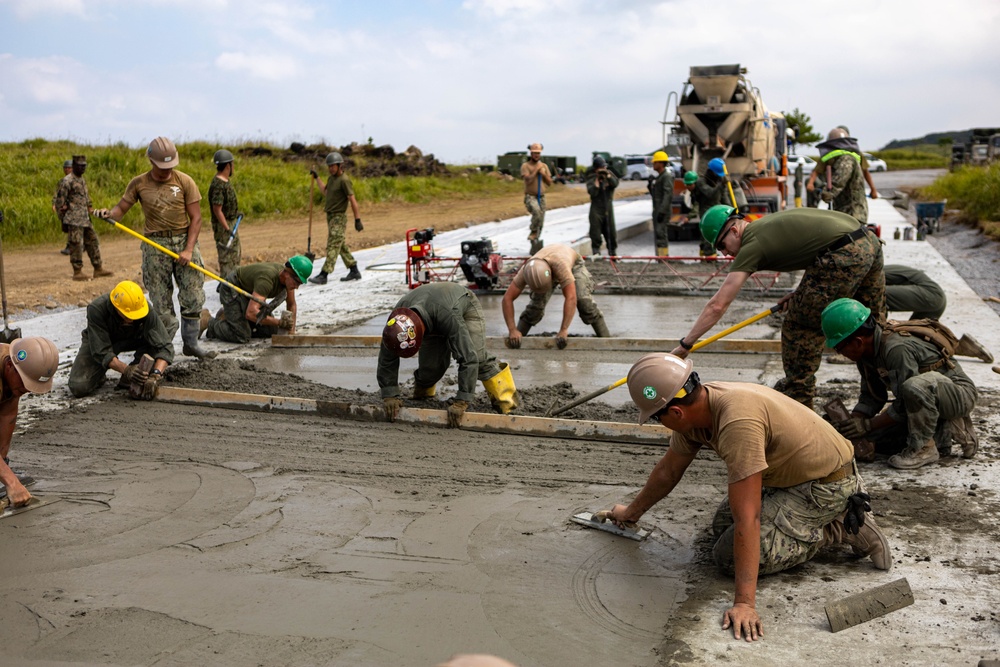 All in a day's work - Japan Ground Self-Defense Force, U.S. Marines, and Sailors prepare Kirishima Training Area for airfield damage repair training