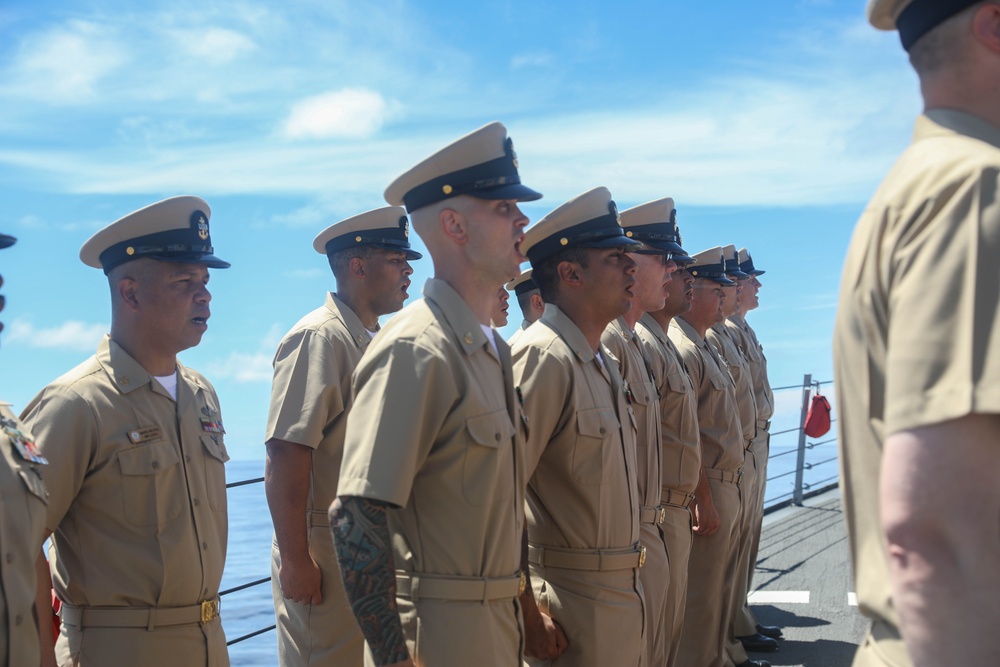 The Arleigh Burke-class guided-missile destroyer USS Rafael Peralta (DDG 115) hosts a chief pinning ceremony on the foc’sle in the South China Sea