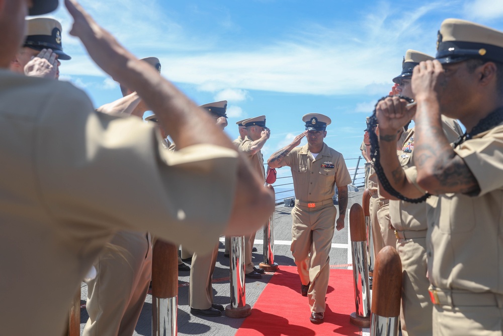 The Arleigh Burke-class guided-missile destroyer USS Rafael Peralta (DDG 115) hosts a chief pinning ceremony on the foc’sle in the South China Sea