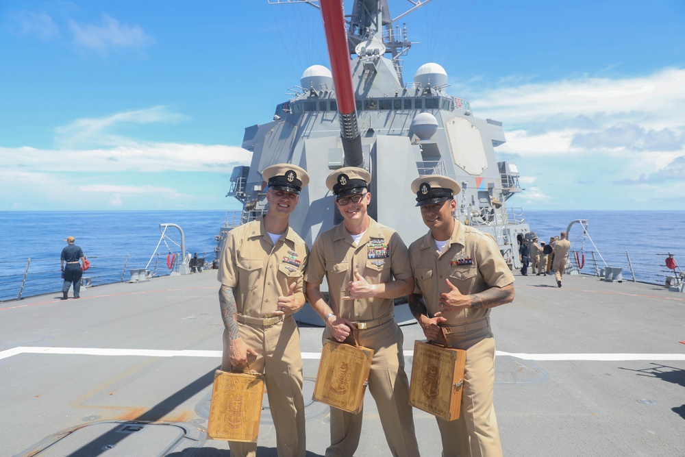 The Arleigh Burke-class guided-missile destroyer USS Rafael Peralta (DDG 115) hosts a chief pinning ceremony on the foc’sle in the South China Sea