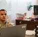 Spc. Luis Marrupe Working in His Office