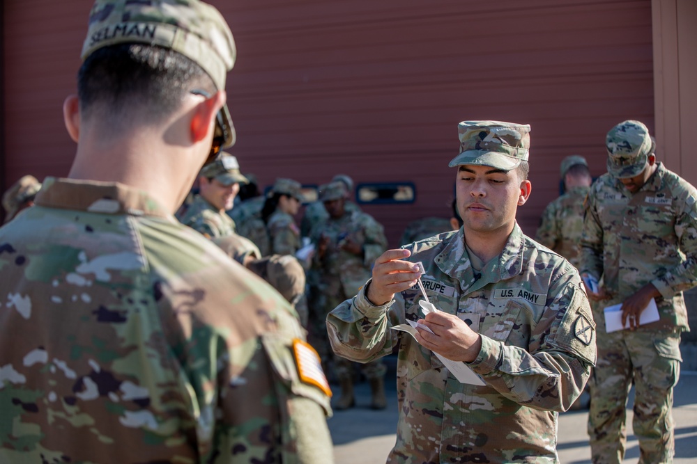 Spc. Marrupe Demonstrates a Sample Collection