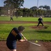 Service Members Play in a Softball Tournament