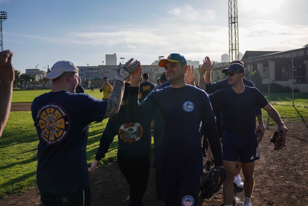 Service Members Play in a Softball Tournament