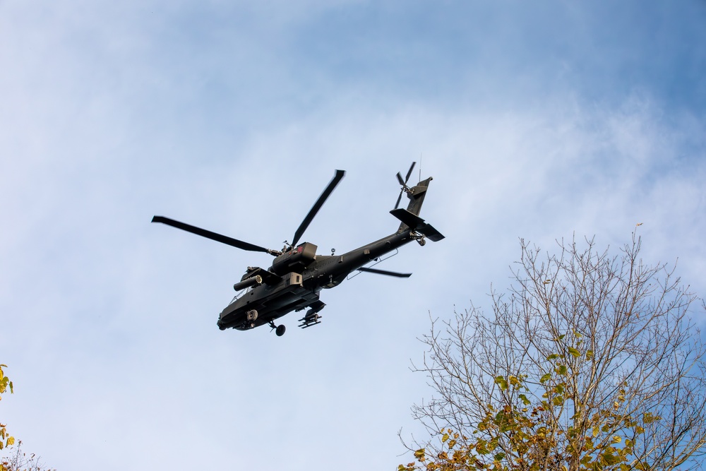 An Apache flies over Range 23 in Fort Drum, NY
