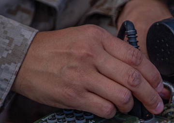 Spectrum warfare Marines set up gear during WTI 1-24