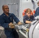 Sailors aboard USS Shoup inspect torpedo tubes