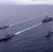 USS Ronald Reagan (CVN 76) steams in formation with guided-missile cruiser USS Antietam (CG 54), JMSDF destroyer JS Yuudachi (DD 103) and JMSDF frigate JS Noshiro (FFM 3)