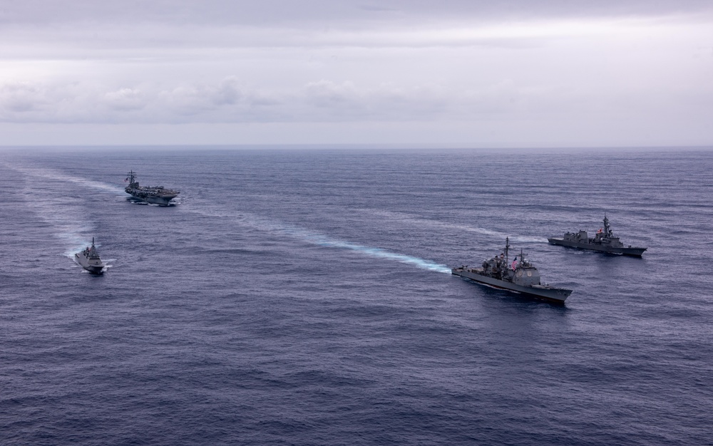 USS Ronald Reagan (CVN 76) steams in formation with guided-missile cruiser USS Antietam (CG 54), JMSDF destroyer JS Yuudachi (DD 103) and JMSDF frigate JS Noshiro (FFM 3)