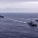 USS Ronald Reagan (CVN 76) steams in formation with guided-missile cruiser USS Antietam (CG 54), JMSDF destroyer JS Yuudachi (DD 103) and JMSDF frigate JS Noshiro (FFM 3)