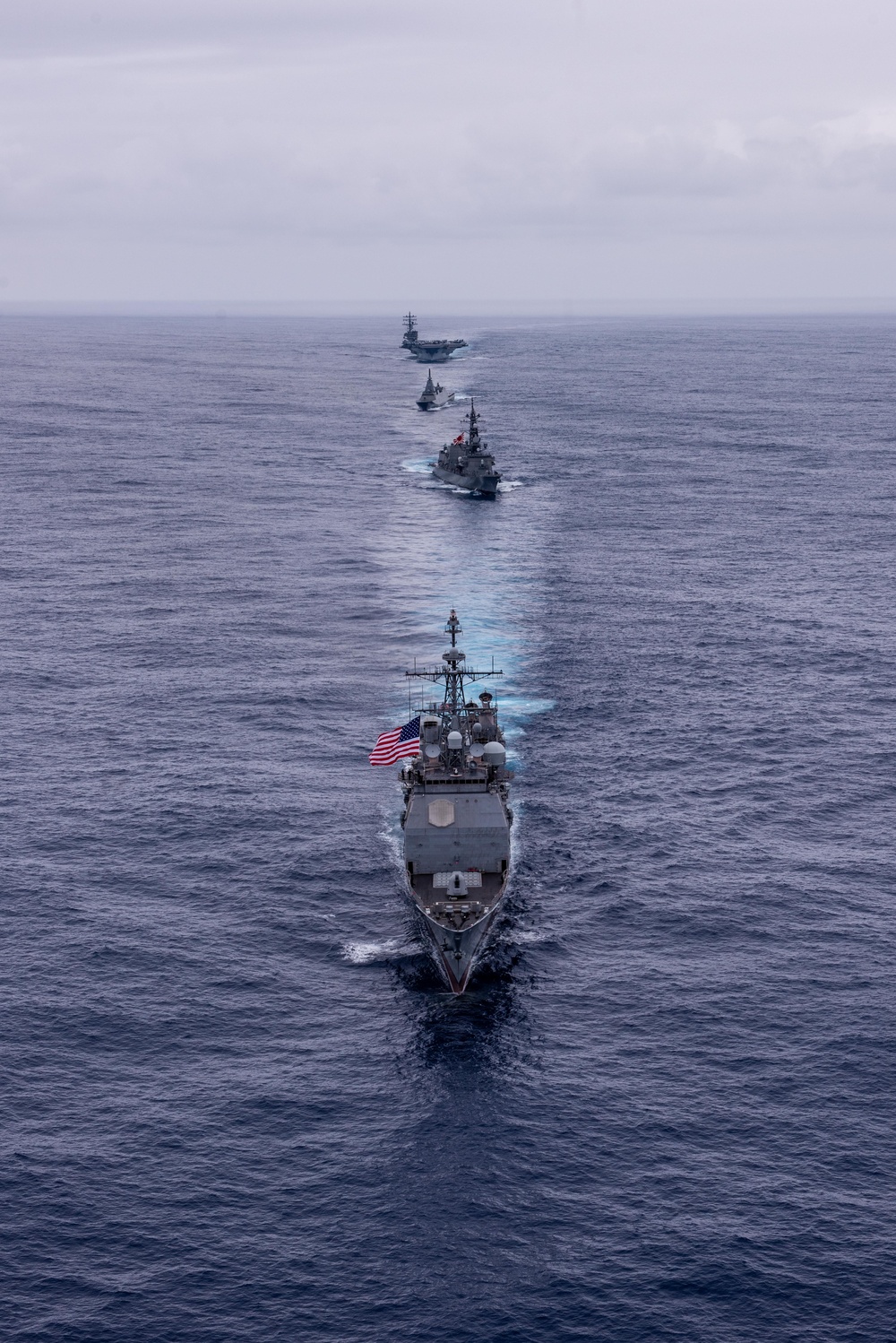 USS Ronald Reagan (CVN 76) steams in formation with guided-missile cruiser USS Antietam (CG 54), JMSDF destroyer JS Yuudachi (DD 103) and JMSDF frigate JS Noshiro (FFM 3)