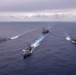 USS Ronald Reagan (CVN 76) steams in formation with guided-missile cruiser USS Antietam (CG 54), JMSDF destroyer JS Yuudachi (DD 103) and JMSDF frigate JS Noshiro (FFM 3)