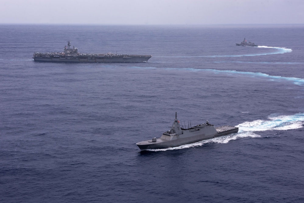 USS Ronald Reagan (CVN 76) steams in formation with guided-missile cruiser USS Antietam (CG 54), JMSDF destroyer JS Yuudachi (DD 103) and JMSDF frigate JS Noshiro (FFM 3)