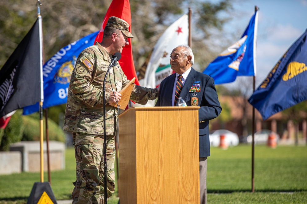 Maj. Gen. James P. Isenhower III Presents Former POW with a plaque