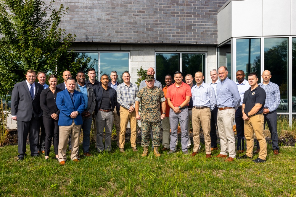 Training Command Commanding General Brig. Gen. Farrell Sullivan takes a group photo with Marine Corps Center for Learning and Faculty Development