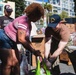 U.S. Navy Sailors distribute food to the local community during San Francisco Fleet Week