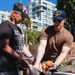 U.S. Navy Sailors distribute food to the local community during San Francisco Fleet Week