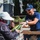 U.S. Coast Guardsman distribute food to the local community during San Francisco Fleet Week
