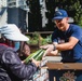 U.S. Coast Guardsman distribute food to the local community during San Francisco Fleet Week