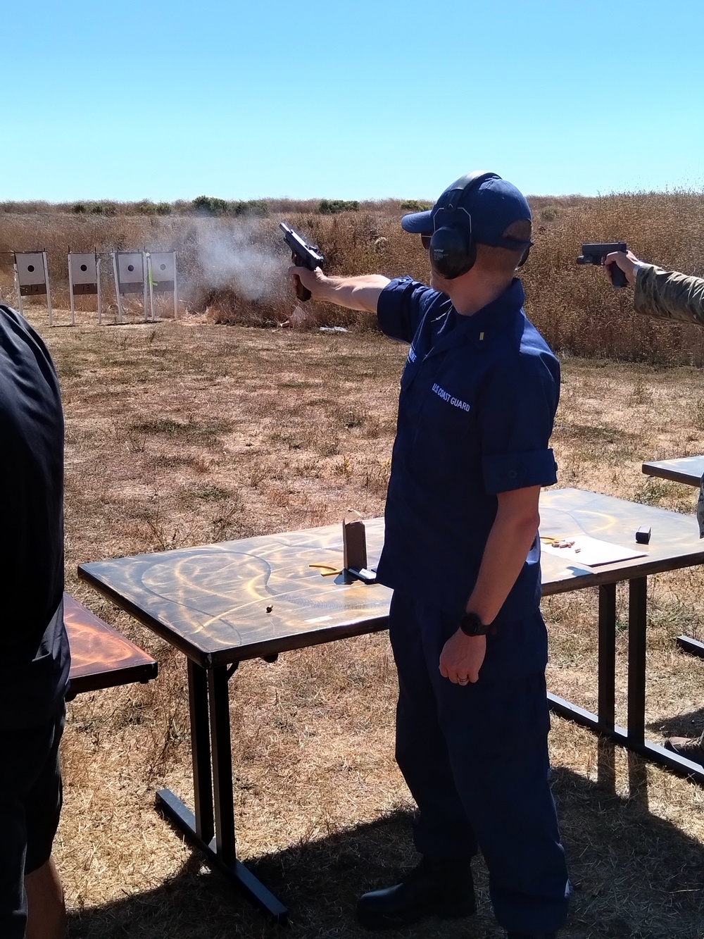 Coast Guard, Navy, Marine Corps service member participate in marksmanship competition