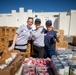 U.S. Coast Guardsmen distribute food to the local community during San Francisco Fleet Week 23