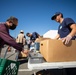 U.S. Coast Guardsmen distribute food to the local community during San Francisco Fleet Week 23