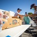 U.S. Coast Guardsmen distribute food to the local community during San Francisco Fleet Week 23