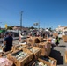 U.S. Coast Guardsmen distribute food to the local community during San Francisco Fleet Week 23