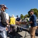 U.S. Coast Guardsmen distribute food to the local community during San Francisco Fleet Week 23