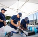 U.S. Coast Guardsmen distribute food to the local community during San Francisco Fleet Week 23