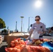 U.S. Coast Guardsmen distribute food to the local community during San Francisco Fleet Week 23