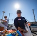 U.S. Coast Guardsmen distribute food to the local community during San Francisco Fleet Week 23