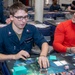 USS Ronald Reagan (CVN 76) Sailors play card games hosted by MWR