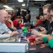 USS Ronald Reagan (CVN 76) Sailors play card games hosted by MWR