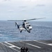 USS Ronald Reagan (CVN 76) conducts vertical replenishment with USNS Charles Drew (T-AKE 10)