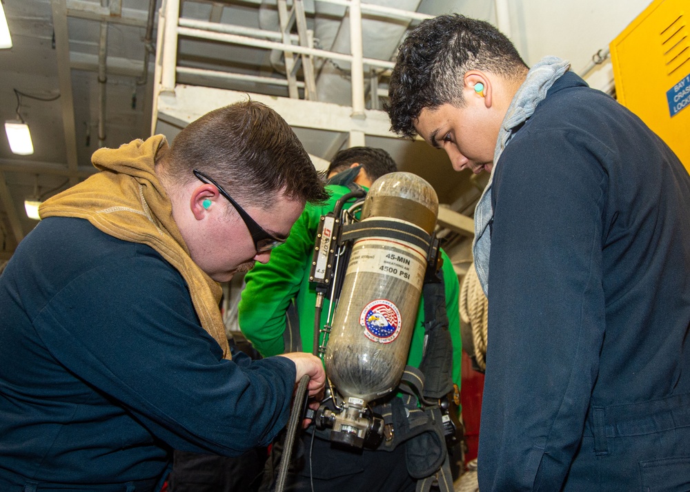 USS Ronald Reagan (CVN 76) Sailors train during a general quarters drill