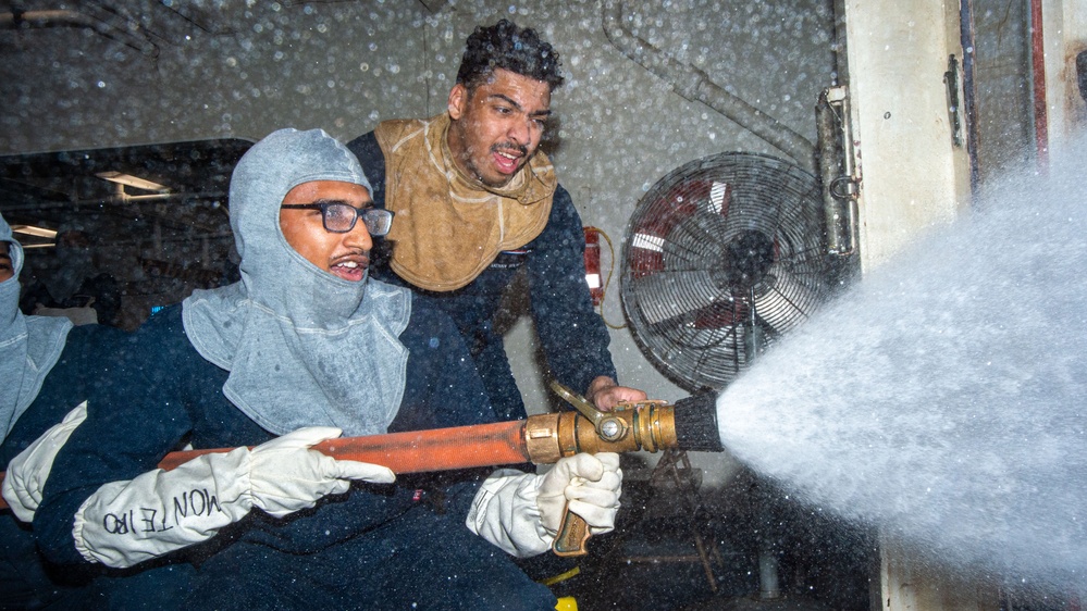 USS Ronald Reagan (CVN 76) Sailors train during a general quarters drill