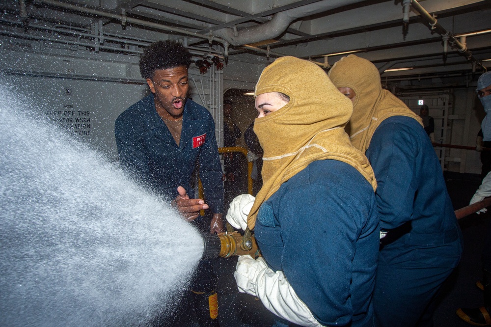 USS Ronald Reagan (CVN 76) Sailors train during a general quarters drill