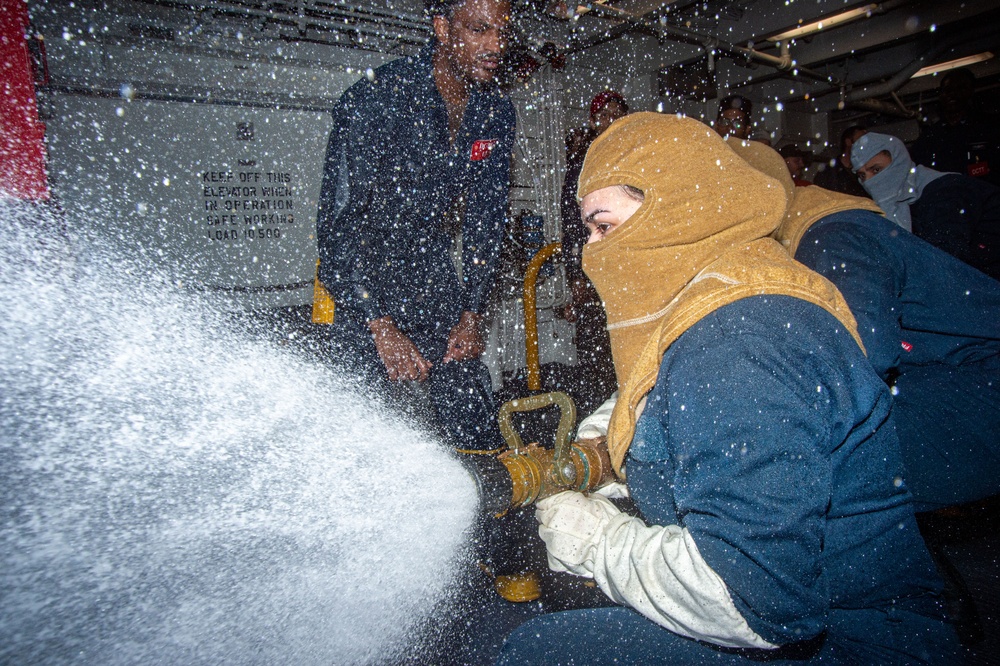 USS Ronald Reagan (CVN 76) Sailors train during a general quarters drill