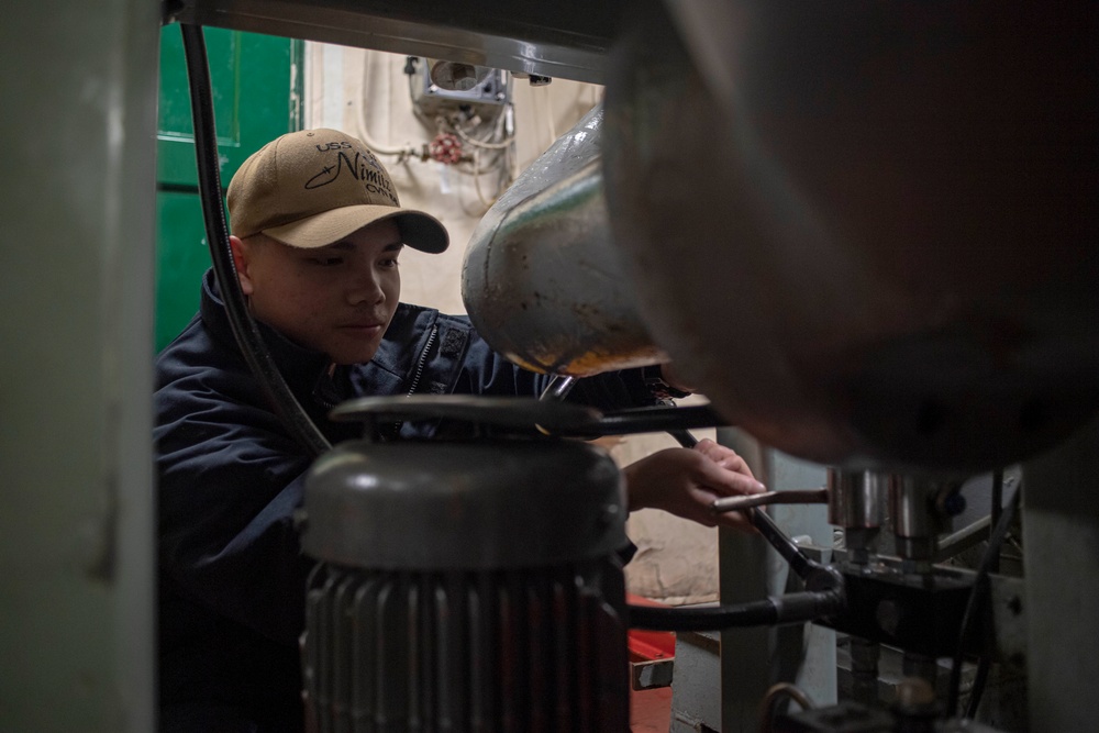 U.S. Navy Sailor Tests Hydraulic Filter