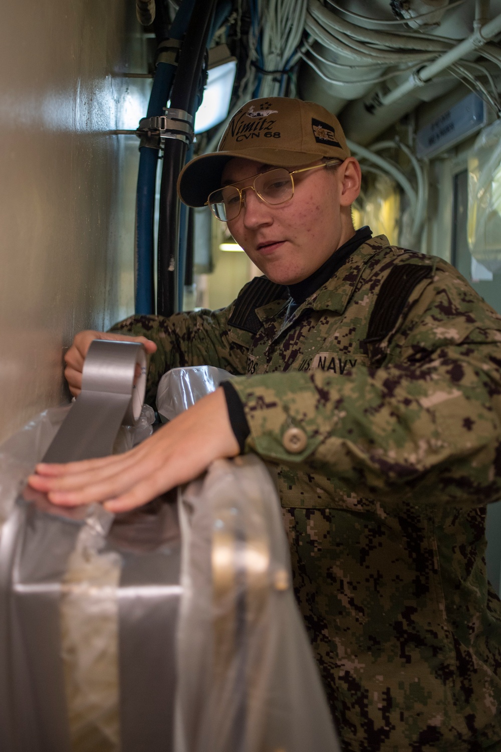 U.S. Navy Sailor Prepares For Painting