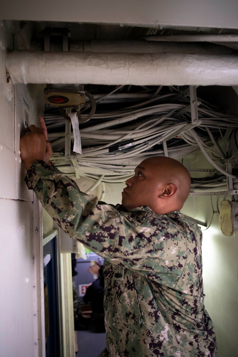 U.S. Navy Sailor Prepares For Painting