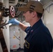 U.S. Navy Sailor Loosens Firehose