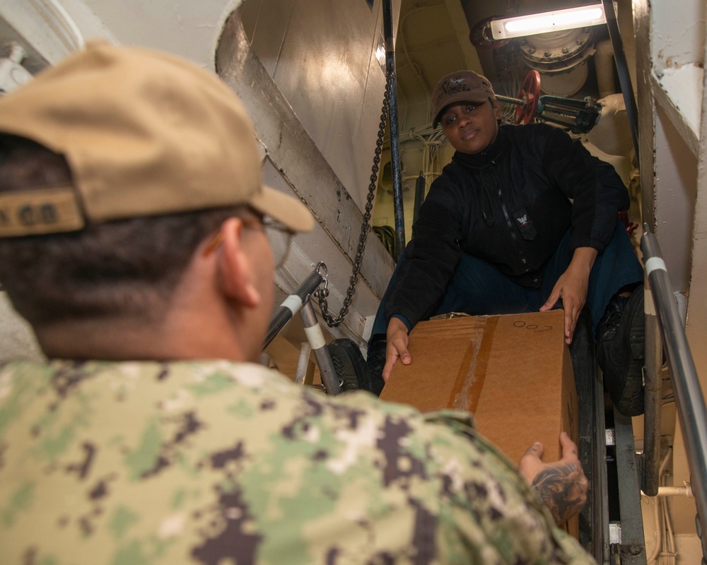 Sailors Transport Cargo Down Ladderwell