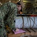 U.S. Navy Sailor Offloads Material