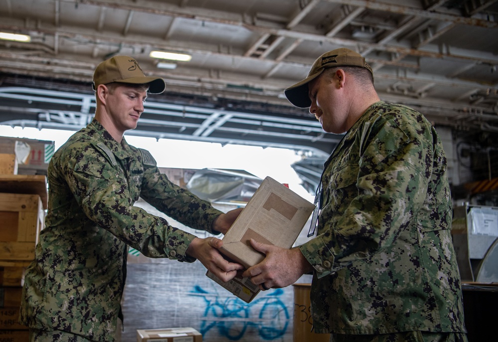 U.S. Navy Sailors Replenish Stock