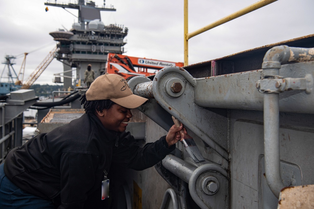 U.S. Navy Sailor Paints Fueling Station