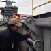 U.S. Navy Sailor Paints Fueling Station