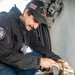 Sailor Removes Paint From Pipe